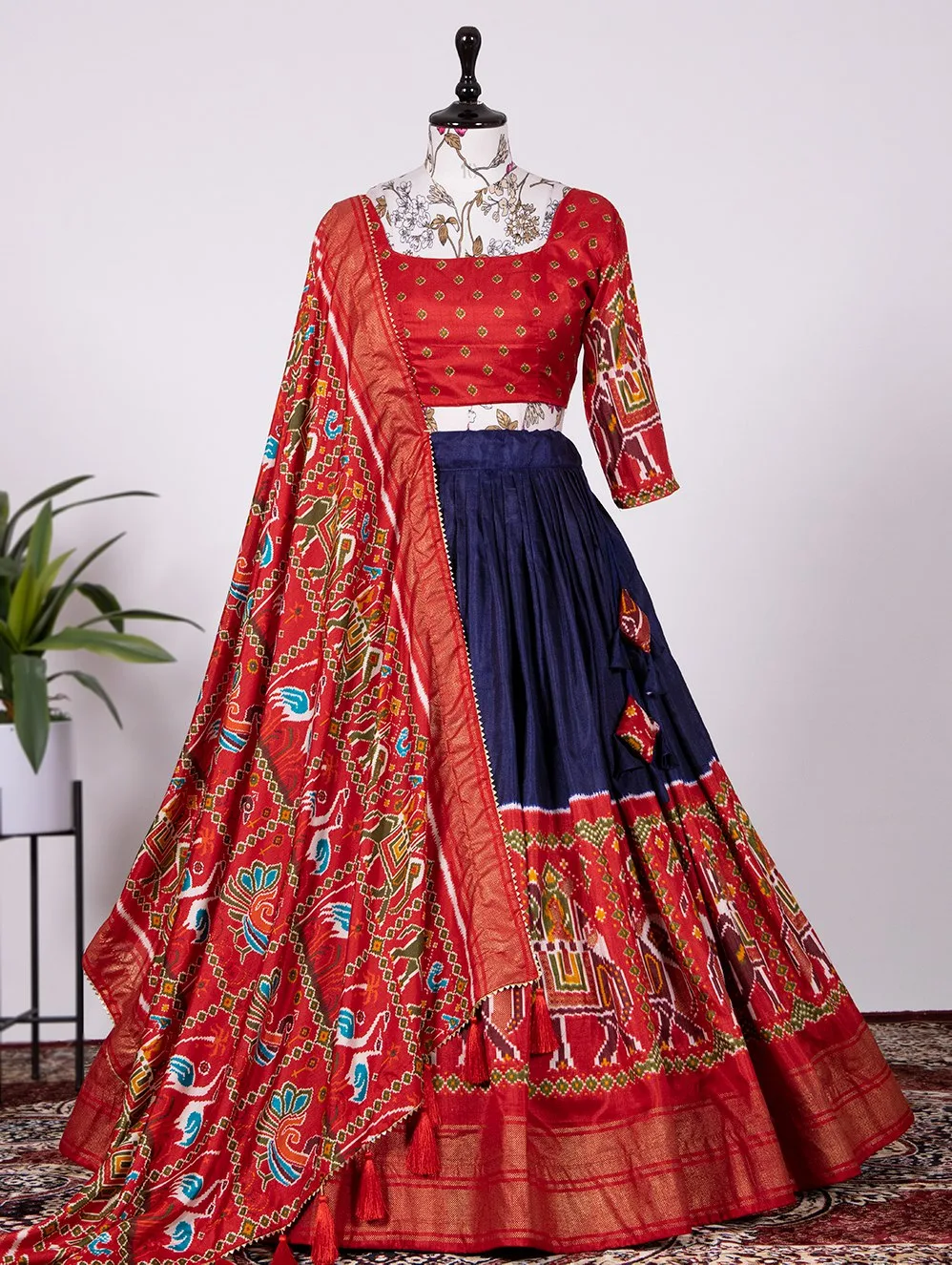 Buy Navy Blue Lehenga with a Red Blouse and an Ivory Dupatta by NIDHI  THOLIA at Ogaan Online Shopping Site